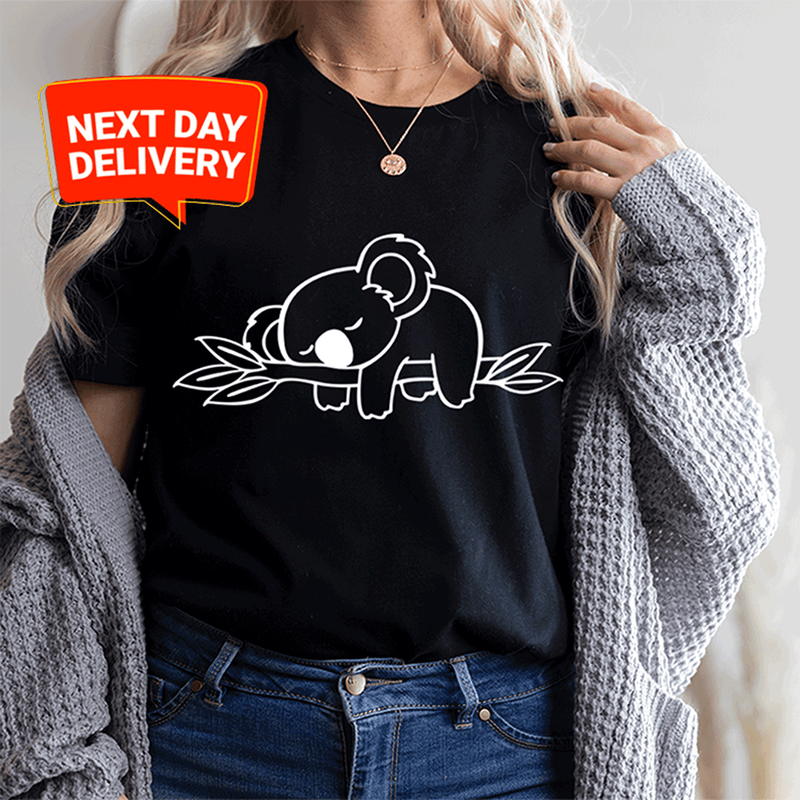 a woman wearing a black t - shirt with an elephant on it