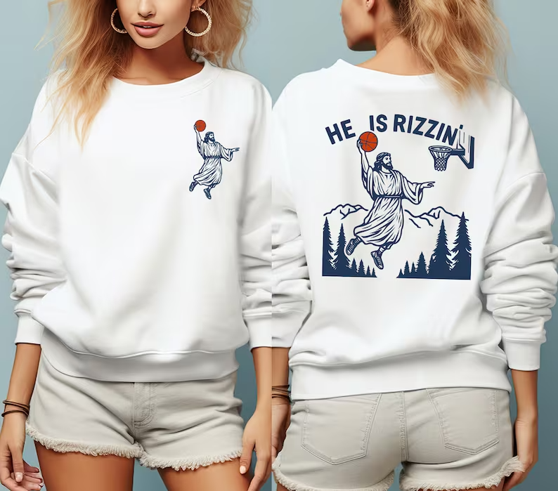 two women wearing sweatshirts that say he is rizzin
